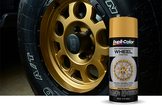Automotive wheel next to a can of Wheel Coating spray paint
